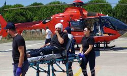 Kafasına harç makinesinin demiri çarpan şahsın yardımına ambulans helikopter yetişti